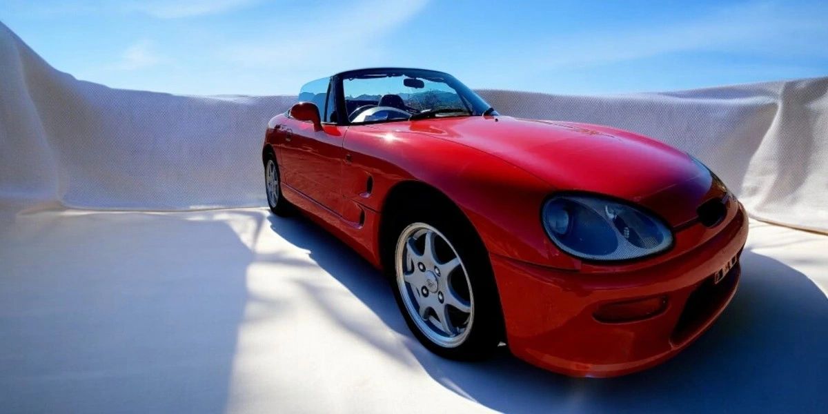 Red Suzuki Cappuccino kei roadster imported from Japan